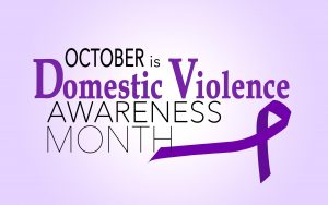 Domestic Violence Awareness Month on a purple background with a purple ribbon